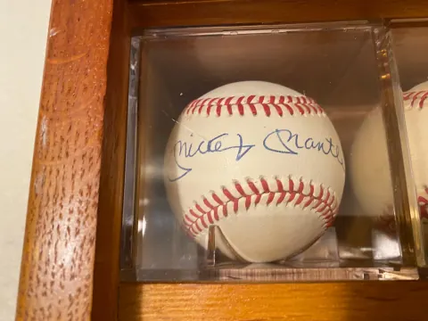 Mickey Mantle autographed official baseball in an acrylic display cube